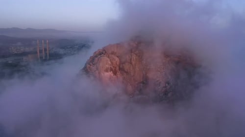 Purple Clouds Floating Low Above Water Scenic Aerial View Sunset