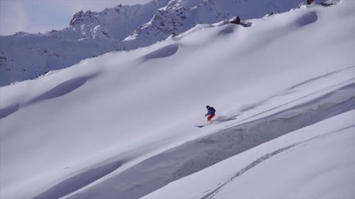 Skiing on snow covered mountains.