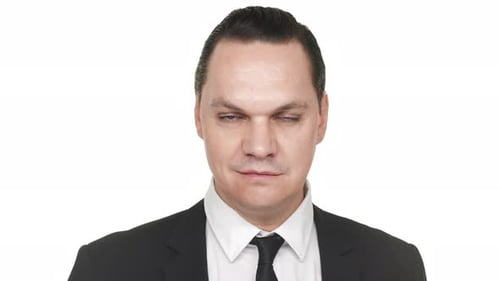 Man in Suit Opens and Closes Eyes