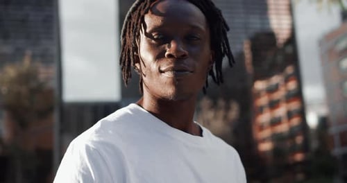 Portrait Modern Adult African American Man Standing Near the Office Building and Looking at Camera