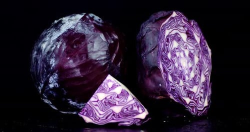 Three Pieces of Cabbage on a Black Background