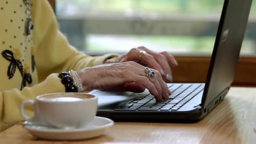 Female Hands Typing in Slow-mo