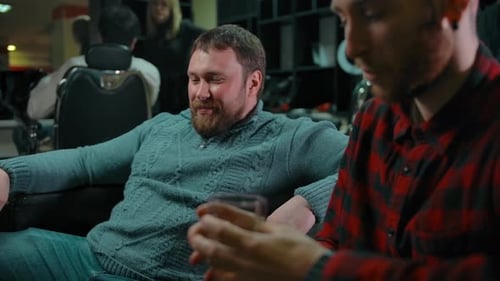 Men Relaxing Together in a Barber Shop