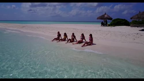 Girls posing on luxury tourist beach voyage by blue green sea with white sand background of the Mald