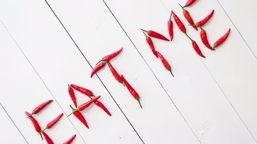 Spicy Message: Red Chili Peppers Spell 'Eat Me'