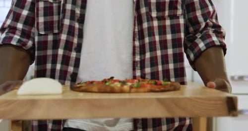 Man making pizza at home