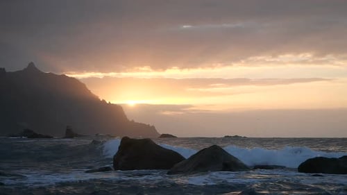 Waves Rise in the Air at Beautiful Sunset Light at Benijo Beach in Tenerife, Canary Islands