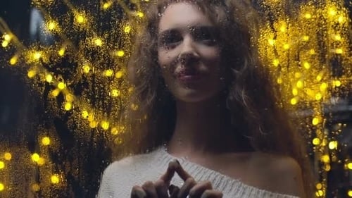 Smiling Woman by Rainy Window at Night