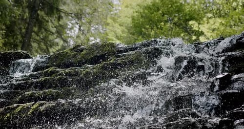 Stunning Slow Establishing Shot of River with Waterfall in Forest in Summer. Slow Motion V3