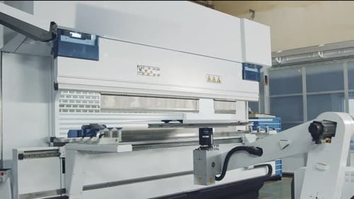 Metal bending robot in a metal production facility