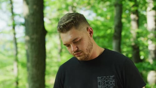 Close Up of Young Adult Male in the Woods