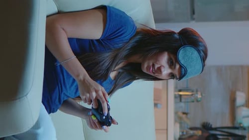 Vertical Video: Determined Woman Playing Video Game