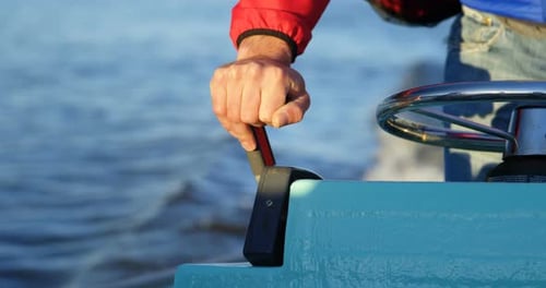 Man riding motorboat in river