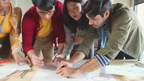 Creative Team Collaborating on a Project in Office