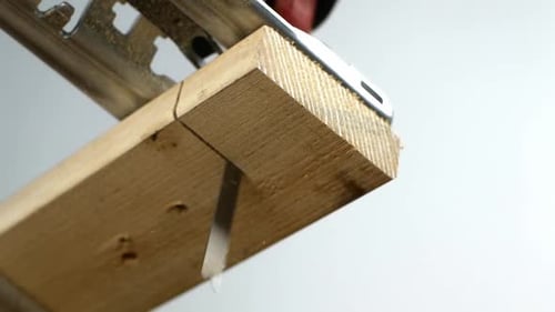Jigsaw Cutting Wood in a Workshop