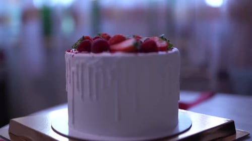 Delicious Frosted Cake Topped with Fresh Berries
