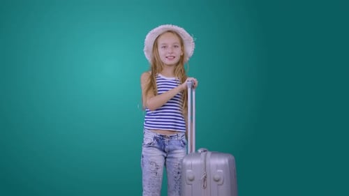 Traveling Girl with Suitcase, Passport and Ticket Isolated on Green Background
