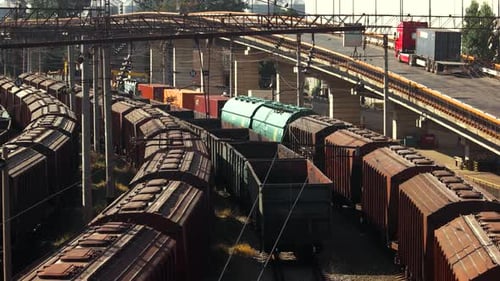 Train Yard with Rail Cars and Railway Bridge
