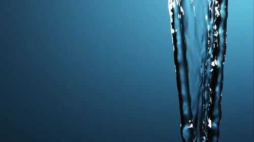 Water Flowing Down on Blue Background