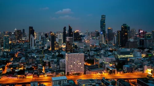 Time Lapse Night Cityscape and Highrise Buildings in Metropolis City Center