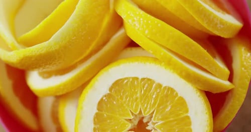 Close Up of Bright Sliced Oranges in Pink Bowl