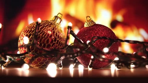 Christmas Baubles by Fireplace with Fairy Lights