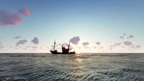 Silhouette Fishing Boat Sailing Across Ocean at Golden Sunrise
