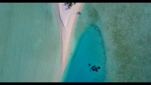 Aerial drone shot tourism of tropical shore beach time by blue ocean with white sandy background of