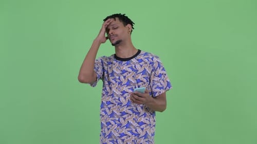 Frustrated Young Adult Using Mobile Phone