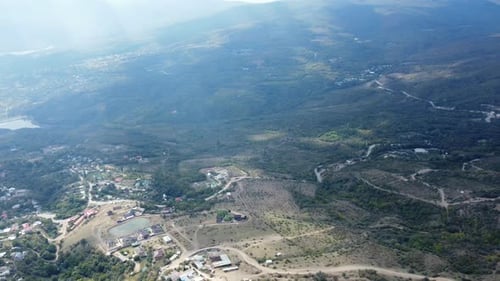 Aerial View of Green Mountains and Rural Landscape