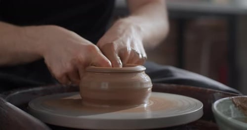 Potter Sculpts a Jug on a Potter's Wheel Video From Pottery Workshop Potter Makes Ceramics in Slow