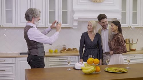 Family Posing for Photo at Birthday Celebration