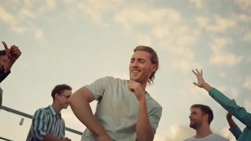 Man Dancing at a Party with Friends