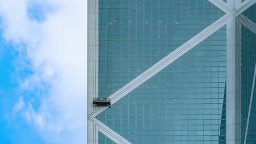 Time lapse of a company group of people, workers or washers cleaning bulilding windows glass.