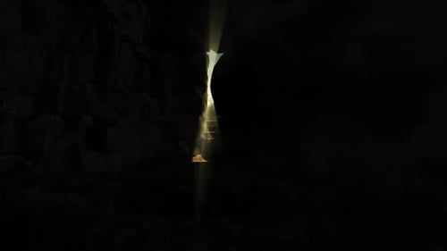 Dramatic Light Revealing Cross in Dark Cave