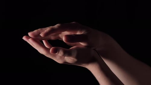 Hands Interacting Together in the Darkness