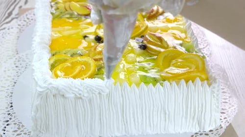 Fruit Topped Cake Decorated with Icing Border