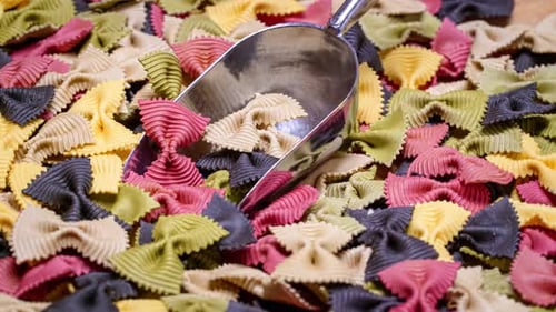 Colorful Bow Tie Pasta with Scoop Close Up