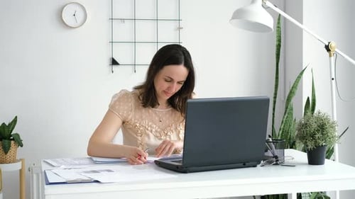 Young Female Employee Working in the Office