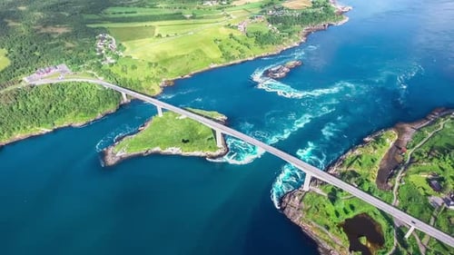 Aerial View of Coastal Bridge and Swirling Water
