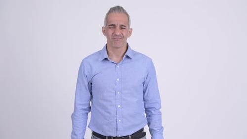 Sad Persian Businessman Giving Thumbs Down Against White Background