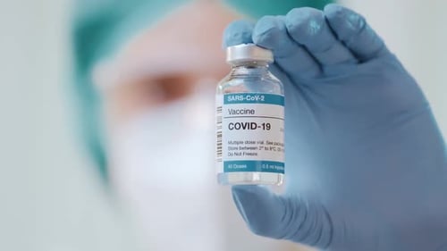 Medical Professional Holding COVID-19 Vaccine Vial