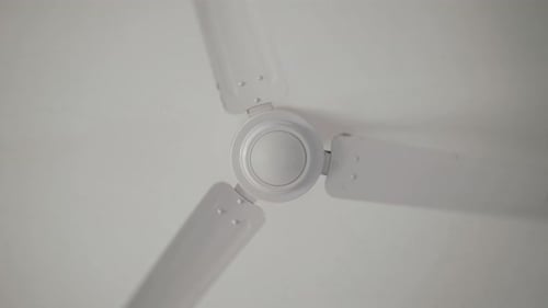 Ceiling Fan and Light Fitting Combination on the Ceiling of a Residential Building Viewed From Below