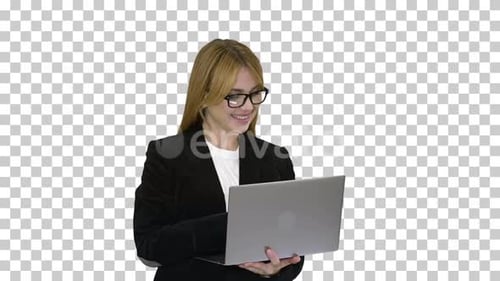 Business woman working on laptop smiling, Alpha Channel
