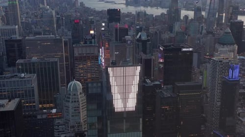 AERIAL: Epic View of Huge Enormous New Manhattan Skyscraper at Sunset with Traffic Lights and New