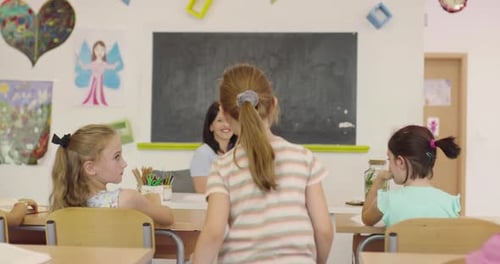 Elementary School Science Classroom Enthusiastic Teacher Explains Chemistry to Diverse Group of