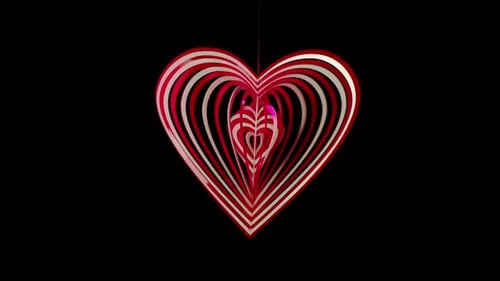 Abstract Rotating Heart Ornament on Black Background