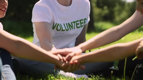 Close Up of Volunteer Family Recycle Plastic Bottle Putting Hands Together Spbi