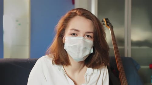 Woman Wearing Face Mask, Smiling Indoors