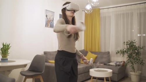 Woman Enjoys Virtual Reality Gaming at Home